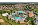 Luxury community with multiple pools, a clubhouse, and sandy beach volleyball at 1410 Wexford Way, Davenport, FL 33896