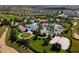 Resort-style pool and clubhouse with surrounding homes and golf course at 1410 Wexford Way, Davenport, FL 33896
