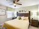 Bedroom with king-size bed and neutral decor at 1410 Wexford Way, Davenport, FL 33896