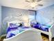 Charming bedroom with Frozen-themed murals and twin beds at 1410 Wexford Way, Davenport, FL 33896