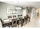 Bright dining room with a large table and seating for eight at 1410 Wexford Way, Davenport, FL 33896