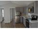 Modern kitchen with gray cabinets and stainless steel appliances at 575 2Nd St, Oviedo, FL 32765
