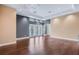 Bright and airy living room with hardwood floors and natural light at 7600 Lake Marsha Dr, Orlando, FL 32819