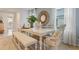 Bright dining room features a spacious table with bench seating, perfect for Gathering meals at 1527 Ellesmere Ave, Haines City, FL 33844