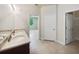 Double vanity bathroom with a view into a bedroom and large closet at 3420 Sagebrush St, Harmony, FL 34773
