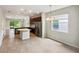 Kitchen dining area with a chandelier and large window at 3420 Sagebrush St, Harmony, FL 34773