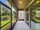 Relaxing screened porch with view of backyard and trees at 3420 Sagebrush St, Harmony, FL 34773