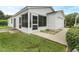 Exterior view of the house with screened porch and garage at 17479 Se 82Nd Pecan Ter, The Villages, FL 32162