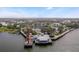 Aerial view of waterfront community with lighthouse and restaurant at 17479 Se 82Nd Pecan Ter, The Villages, FL 32162