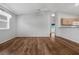 Bright living room featuring wood flooring and neutral walls at 17479 Se 82Nd Pecan Ter, The Villages, FL 32162
