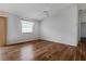 Spacious bedroom with wood floors and neutral decor at 17479 Se 82Nd Pecan Ter, The Villages, FL 32162