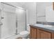Bathroom with walk-in shower and wood vanity at 17479 Se 82Nd Pecan Ter, The Villages, FL 32162