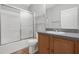 Clean bathroom with shower/tub combo and wood vanity at 17479 Se 82Nd Pecan Ter, The Villages, FL 32162