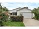 Cute single story home with attached garage and well manicured landscaping at 17479 Se 82Nd Pecan Ter, The Villages, FL 32162