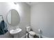 Clean bathroom with a pedestal sink and toilet at 1084 Sadie Ridge Rd, Clermont, FL 34715