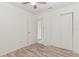 Spacious bedroom with wood-look floors and double closets at 1395 San Luis Ct, Winter Springs, FL 32708