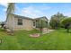 House exterior with well-manicured lawn and screened porch at 17394 Se 74Th Seabrook Ct, The Villages, FL 32162