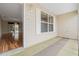 Covered porch with view into living area, wood-look flooring at 17394 Se 74Th Seabrook Ct, The Villages, FL 32162