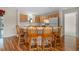 Kitchen with island and light wood cabinets at 17394 Se 74Th Seabrook Ct, The Villages, FL 32162