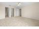 Large bedroom with carpet, double closets, and access to hallway at 17394 Se 74Th Seabrook Ct, The Villages, FL 32162