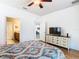 Bedroom with ensuite bathroom and dresser at 515 Pamplona Pl, Davenport, FL 33837
