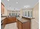 Spacious kitchen featuring an island, stainless steel appliances, and ample cabinetry at 143 Brunswick Dr, Davenport, FL 33837