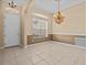 Formal dining room with chandelier and tile floors at 143 Brunswick Dr, Davenport, FL 33837