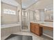 Large bathroom with a walk-in shower and a soaking tub at 143 Brunswick Dr, Davenport, FL 33837