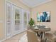 Dining area with stylish table setting and access to patio at 143 Brunswick Dr, Davenport, FL 33837