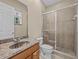 Clean bathroom with granite countertop and a shower at 143 Brunswick Dr, Davenport, FL 33837