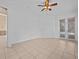 Bedroom with tile floors and access to a patio at 143 Brunswick Dr, Davenport, FL 33837
