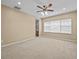 Spacious bedroom with carpet, window with blinds, and ensuite bathroom at 143 Brunswick Dr, Davenport, FL 33837