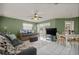 Cozy living room featuring a daybed and access to the patio at 2101 Appy Ln, Apopka, FL 32712