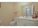 Small half bathroom with single vanity and toilet at 2101 Appy Ln, Apopka, FL 32712