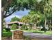 Club Villas community entrance with lush landscaping at 3012 S Semoran Blvd # 3, Orlando, FL 32822