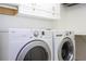 White laundry room with LG washer and dryer at 13272 Roxboro Rd, Windermere, FL 34786