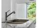 Modern kitchen features granite countertop and chrome faucet at 2866 Lingo Ln, Orlando, FL 32822