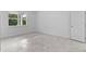 Bright bedroom with large window and tile flooring at 2866 Lingo Ln, Orlando, FL 32822