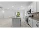 Modern kitchen with white cabinets, granite island and stainless steel appliances at 2866 Lingo Ln, Orlando, FL 32822