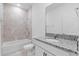 Clean bathroom, featuring granite countertop, a bathtub, and tile flooring at 2866 Lingo Ln, Orlando, FL 32822