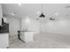 Open kitchen with island, granite countertops, and stainless steel appliances at 2866 Lingo Ln, Orlando, FL 32822