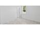Simple bedroom with tile flooring and an exterior door at 2866 Lingo Ln, Orlando, FL 32822