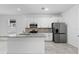 Modern kitchen with white cabinets, granite countertops, and island at 2866 Lingo Ln, Orlando, FL 32822