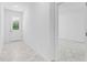 Bright foyer with light gray tile flooring and white walls at 2866 Lingo Ln, Orlando, FL 32822