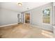 Bright bedroom with large window and ensuite bathroom access at 1473 Farrindon Cir, Lake Mary, FL 32746