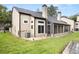 House exterior showcasing a screened porch and well-maintained lawn at 1473 Farrindon Cir, Lake Mary, FL 32746