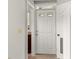 Bright and airy entryway with a white door and access to other rooms at 1473 Farrindon Cir, Lake Mary, FL 32746