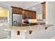 Kitchen boasts granite countertops and wood cabinets at 1473 Farrindon Cir, Lake Mary, FL 32746