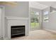 Living room features a fireplace with large windows providing abundant natural light at 1473 Farrindon Cir, Lake Mary, FL 32746