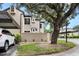 Tan house exterior with carport and landscaping at 1473 Farrindon Cir, Lake Mary, FL 32746